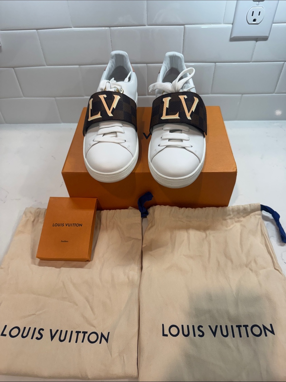 Worn once~Louis Vuitton Front row  White Sneakers with Brown Monogram LV Strap.